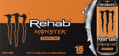 Pouring Monster Rehab Peach Tea + Energy into a glass for a refreshing sip