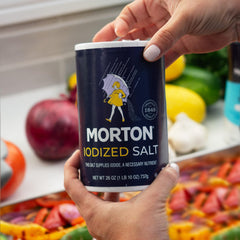 Morton iodized salt sprinkle on food for even flavor distribution