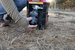 Mr. Heater Fuel Keg 1lb tank in hand shows portability for outdoor use.