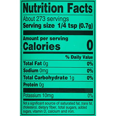 Mrs. Dash garlic herb shaker pours to enhance grilled meats and vegetables.