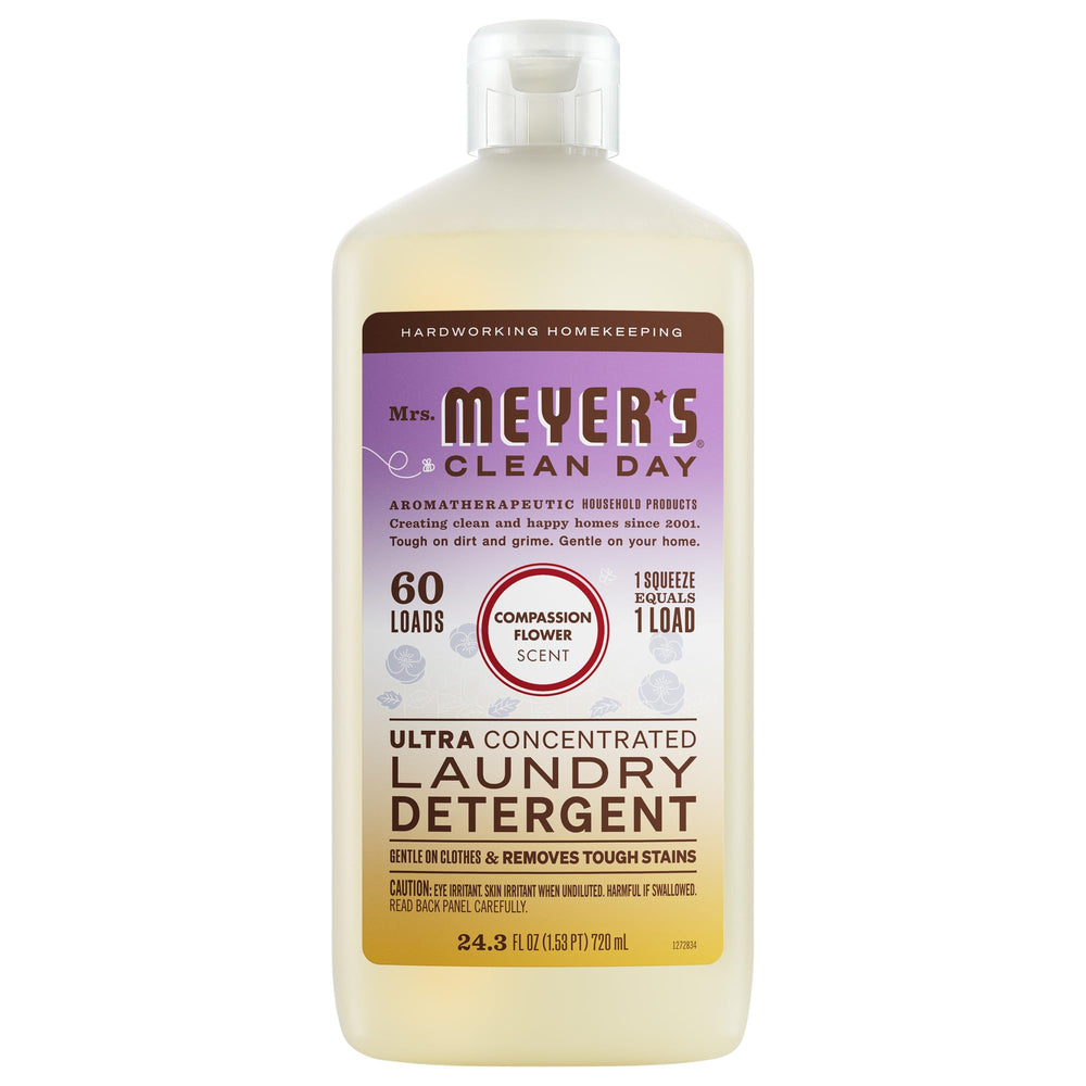 Mrs. Meyer’s Clean Day Compassion Bottle on a shelf, gentle laundry cleaning with a garden-inspired scent.