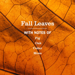 Close-up of Fall Leaves bottle on glass and metal surfaces.