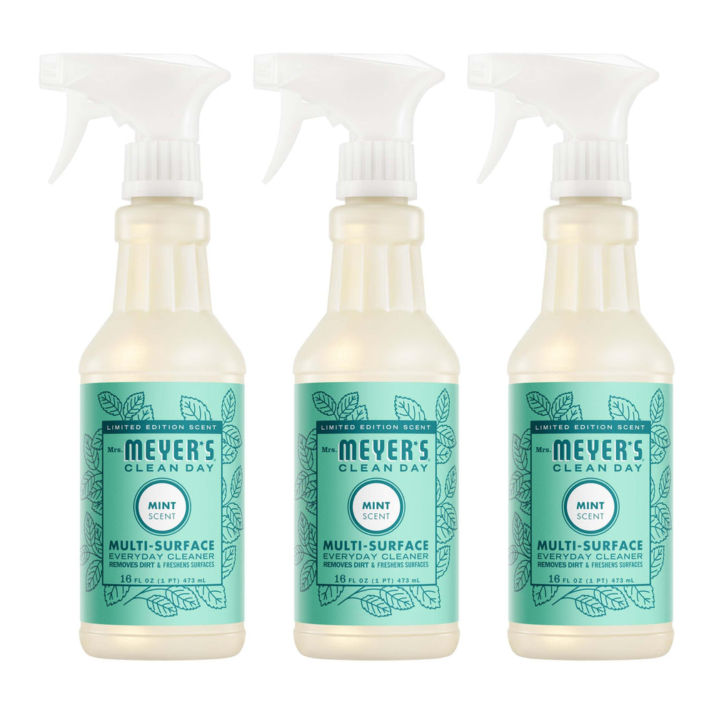 Mrs. Meyer's Clean Day Mint bottle pouring for quick spray-and-wipe cleanup.