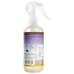 Compassion Flower spray mist near label highlights peaceful, garden-inspired aroma.
