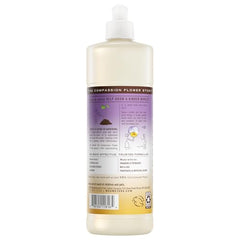 Pouring Mrs. Meyer's Compassion Flower dish soap for quick, grease-cutting cleaning.
