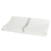Munchkin Secure Grip changing pad on dresser provides stable support during diaper changes.