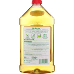 Pouring Murphy Original Oil Soap onto a wood surface for gentle cleaning