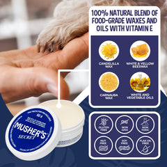 Close-up of Musher's Secret paw wax texture showing a rich, moisturizing formula.