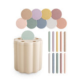 Mushie Coin & Tube Sorting Set box open, colorful coins ready for sorting to boost fine motor skills.