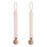 Mushie linen pacifier clip blush close-up, secure hold for on-the-go soothing