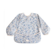 Mushie long sleeve bib blue flowers front view showing protective coverage during meals