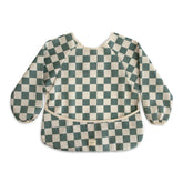 Mushie long sleeve bib olive check front view offers full coverage to protect outfits.