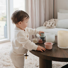 Mushie made-in-denmark image showcases craftsmanship encouraging curious, safe stacking.