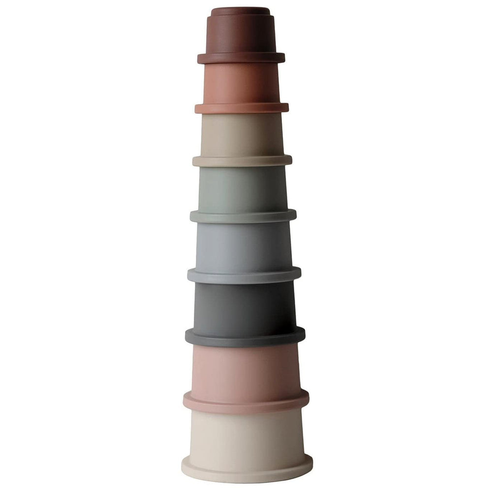 Mushie round tower stacking cups image highlights fine motor skills and hand-eye coordination.