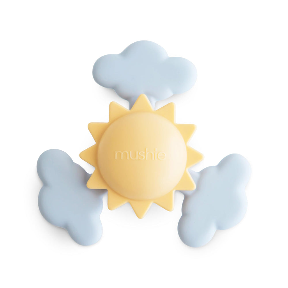 Mushie Sunshine Suction Spinner Toy with sun and clouds for engaging tactile exploration.
