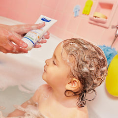 Mustela curly hair definition with shea butter for defined curls.