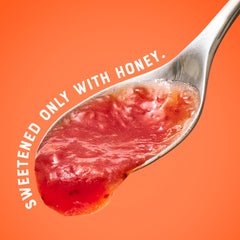 Close-up of real strawberries and honey in Nate's spread, no refined sugar