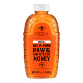 Nate's Honey Georgia raw unfiltered 32oz bottle pour showcases easy drizzle ability for breakfast or snack use