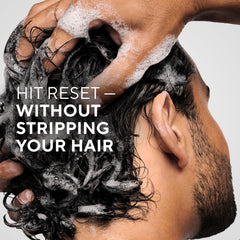Creamy lather forming as Native Scalp Detox Shampoo works in shower