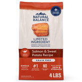 Natural Balance salmon and sweet potato dry dog food bag shows grain-free formula for sensitive stomachs