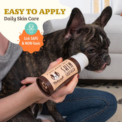 Natural Dog Company Skin Soother Balm ingredients Cocoa Butter and Chamomile highlighted on packaging.
