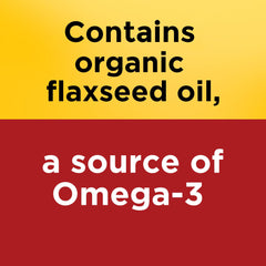Nature Made flaxseed oil softgels being poured into glass for daily routine.