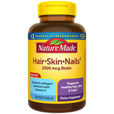 Nature Made Hair Skin and Nails bottle displaying daily biotin support for healthy appearance.