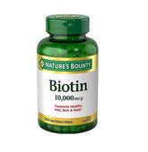 Nature's Bounty Biotin 10,000 mcg softgel bottle supports hair, skin and nails.