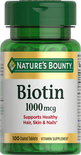 Nature's Bounty Biotin bottle close-up emphasizing energy metabolism support