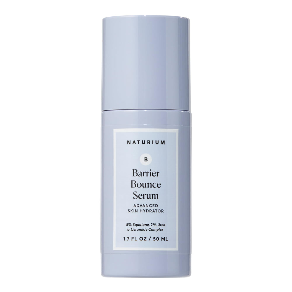 Naturium Barrier Bounce Serum bottle on a clean vanity showing daily hydration and dewy glow.