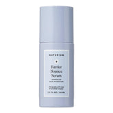Naturium Barrier Bounce Serum bottle on a clean vanity showing daily hydration and dewy glow.
