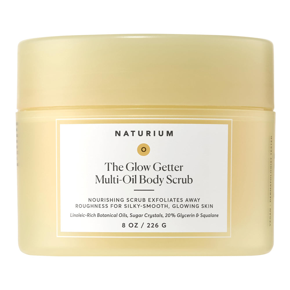 Naturium Glow Getter Body Scrub jar close-up showing exfoliating sugar crystals for radiant skin