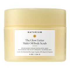 Naturium Glow Getter Body Scrub jar close-up showing exfoliating sugar crystals for radiant skin