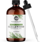 NaturoBliss Cedarwood essential oil bottle with pour top for precise diffuser blends.