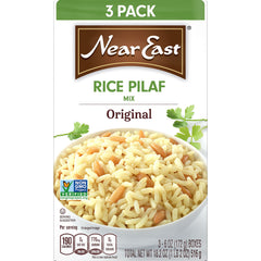 Serving Near East Rice Pilaf Original in a bowl with a colorful sides.