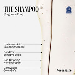 Nécessaire Hair Duo shampoo bottle close-up with visible lather.