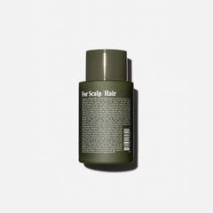Nécessaire Rosemary Conditioner bottle pour suggests easy application and smooth detangling while styling.