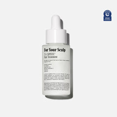Nécessaire Scalp Serum pipette demonstrates precise dosing for targeted scalp application.