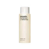 Nécessaire The Shampoo bottle front shows fragrance-free formula for sensitive scalps.