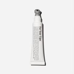 Nécessaire The Lip Balm being applied on lips for instant moisture.