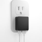 Nekmit dual-port ultra-thin charger shown in slim profile for travel convenience and fast charging.
