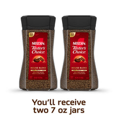 NESCAFÉ Taster's Choice instant coffee being scooped for a quick brew