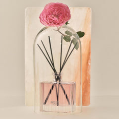 Nest New York diffuser bottle on a coffee table creating a calm, inviting space