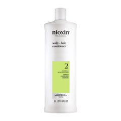Nioxin System 2 conditioner bottle front highlights sleek design for thicker-looking hair.