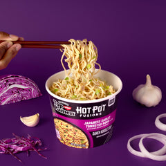 NISSIN Top Ramen Hot Pot Fusions black garlic oil closeup emphasizes rich aroma.