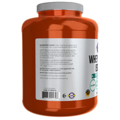 NOW Foods Whey Protein Isolate unflavored powder poured into a shaker bottle