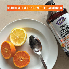Close-up of NOW Foods L-Carnitine Liquid label emphasizing pure vegan quality