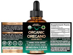 NUTRAHARMONY oregano oil drops label shows organic certification and quality assurance.