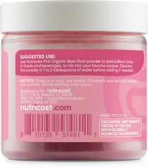 Nutricolor pink beet powder scoop ready for easy recipe measurements.