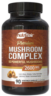 NutriFlair mushroom supplement bottle on desk for daily vitality.